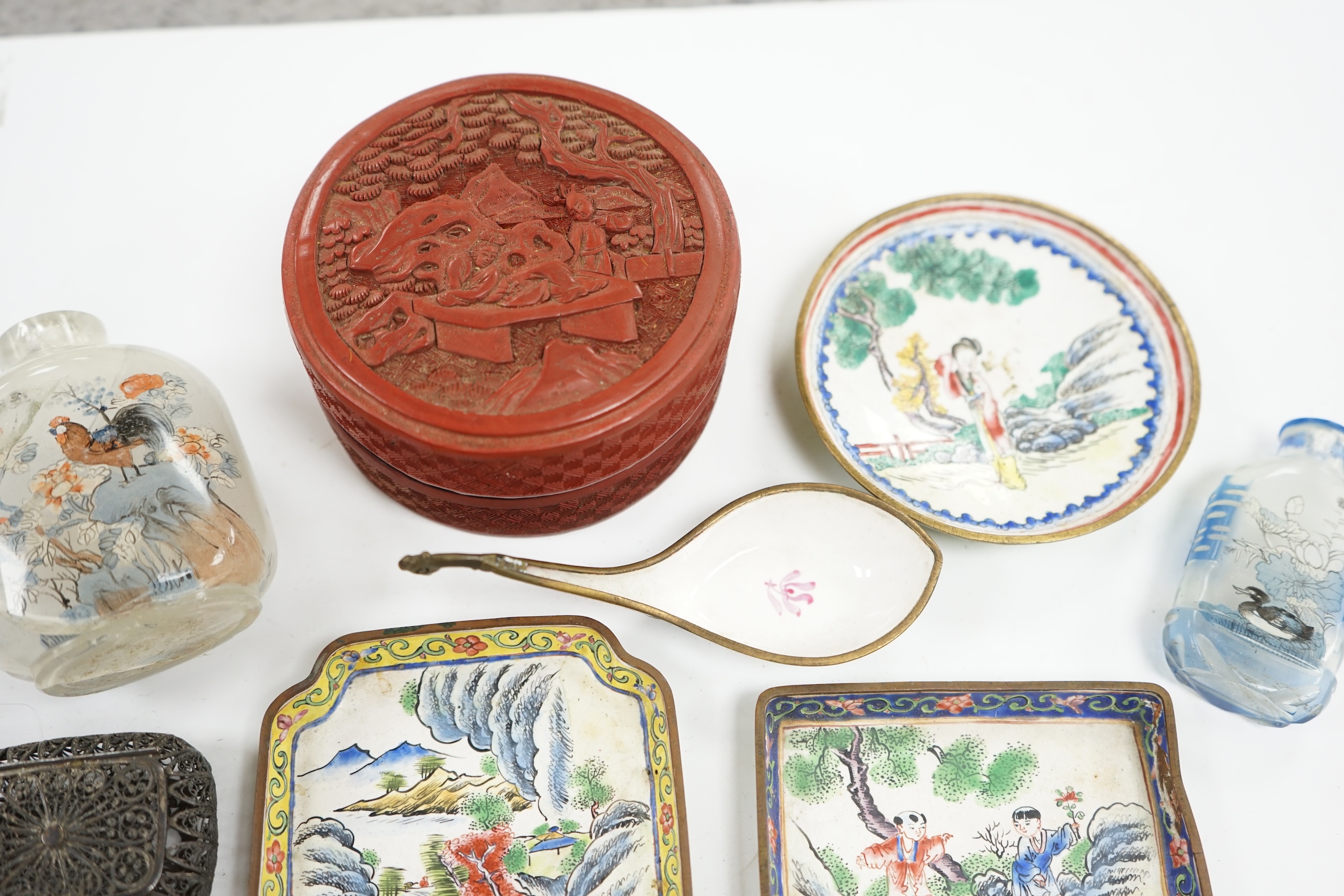 A group of Chinese Canton enamel trays, a Chinese lacquer box and cover, snuff bottles, two filigree work boxes, and a champlevé enamel box and cover, largest 10cm in diameter. Condition - varies